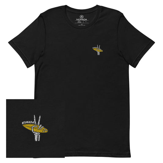 NOMADA Skeleton Hand Showing Peach Sign while holding a Surfboard embroidered T-Shirt, Black color shirt