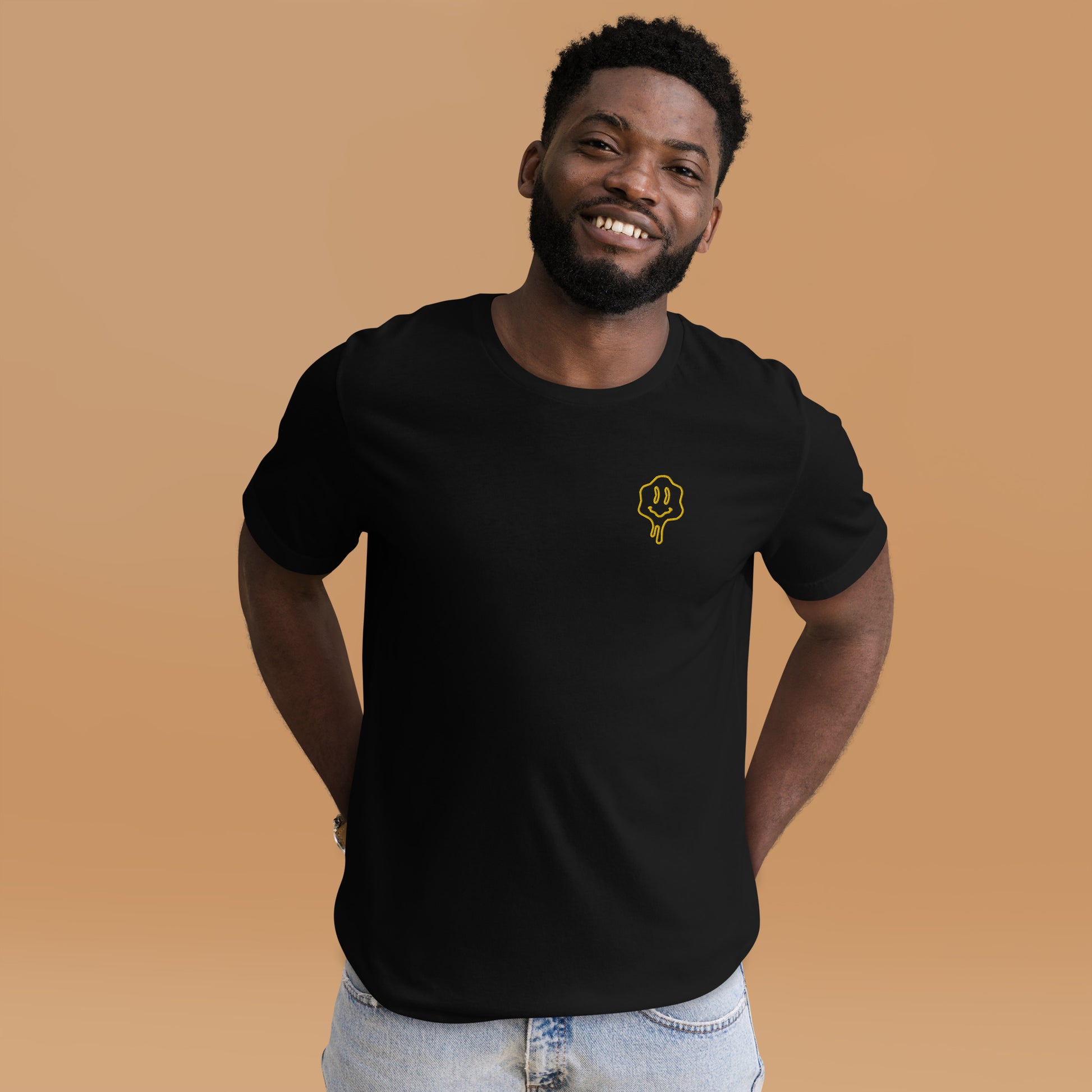 Man wearing NOMADA Melting Smiley Face embroidered T-shirt, Black color shirt