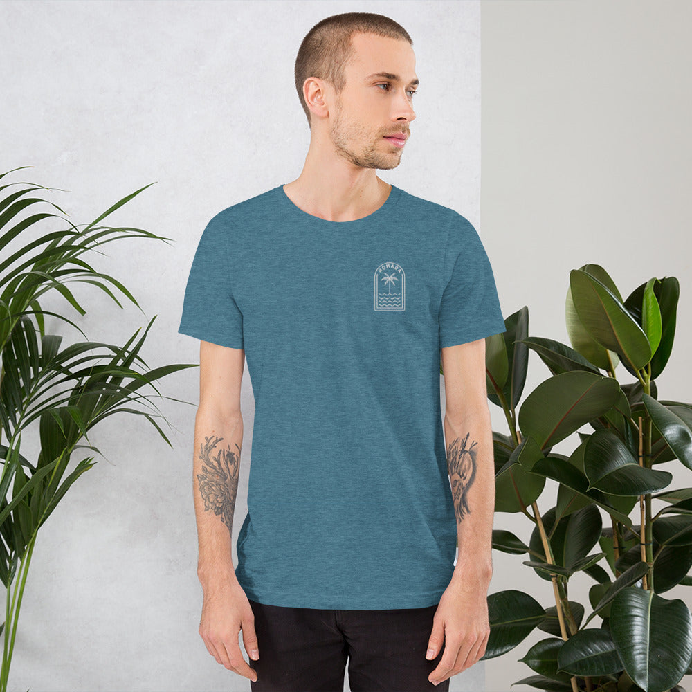 Man wearing NOMADA Palm Tree Lines embroidered T-Shirt, Heather Deep Teal color shirt