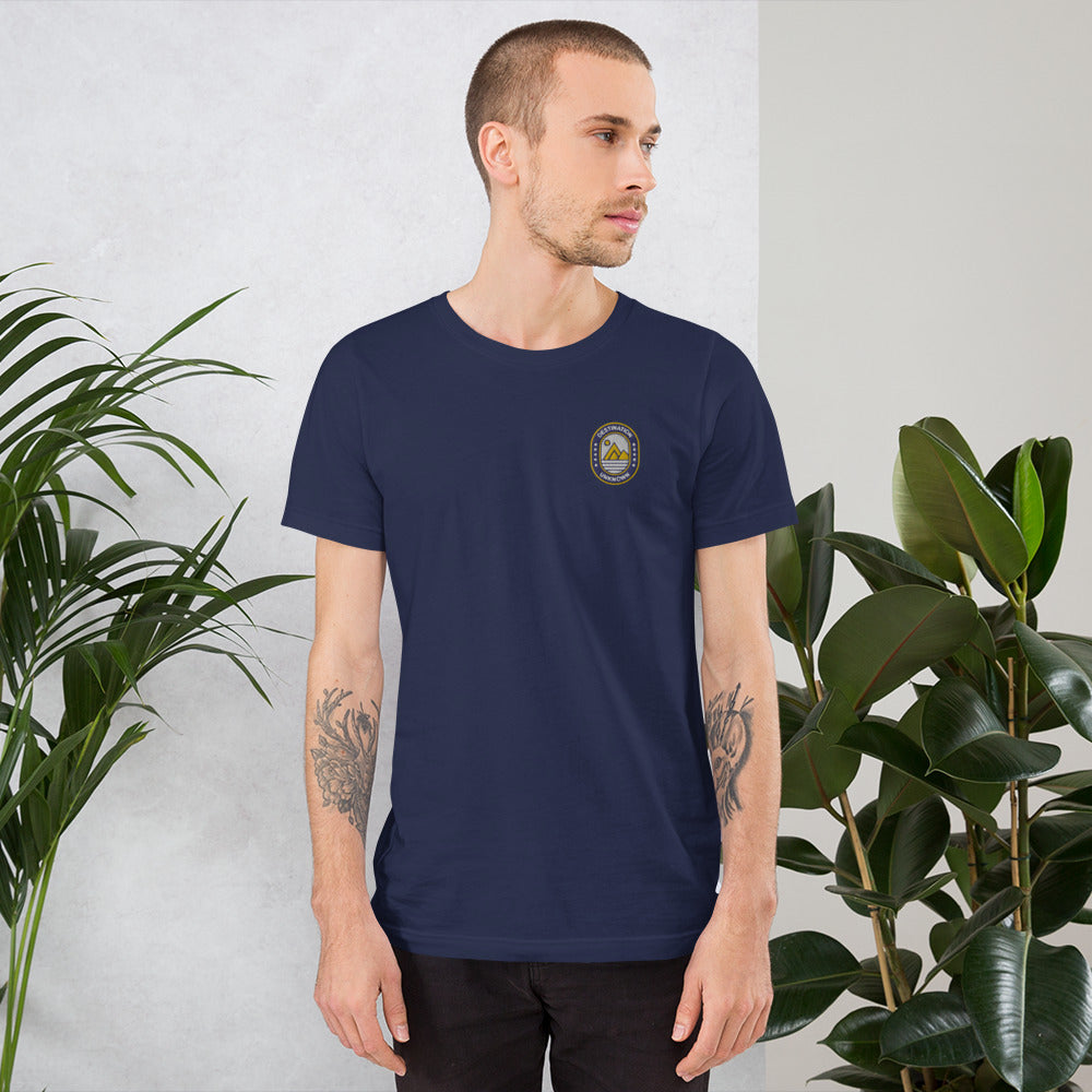 Man wearing NOMADA Mountain & Sun Camper Patch embroidered T-shirt, Navy Blue color shirt